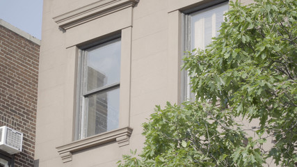 Close up exterior establishing shot of a concrete apartment or office building day time outside dx. NYC Brooklyn type of setting