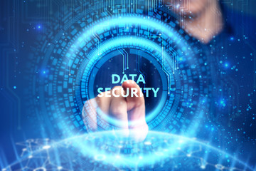 Business, Technology, Internet and network concept. Young businessman working on a virtual screen of the future and sees the inscription: Data security