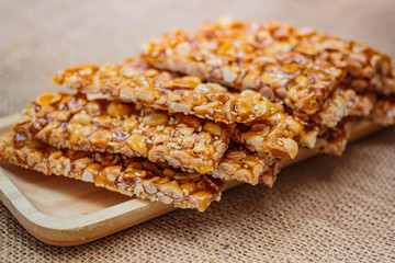 Peanut sesame snack, (Tua gra joak) sweet peanuts stick. © tachjang