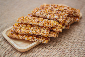 Peanut sesame snack, (Tua gra joak) sweet peanuts stick. © tachjang