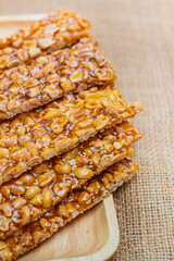 Peanut sesame snack, (Tua gra joak) sweet peanuts stick. © tachjang