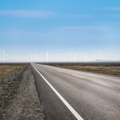 Fototapeta premium road on wilderness and wind power farm