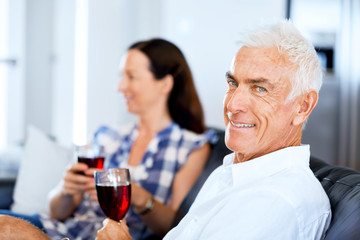 Portrait of a couple having a glass of red wine