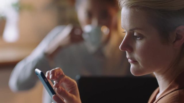 close up professional business woman in cafe using smartphone browsing online reading email messages drinking coffe female entrepreneur networking on social media enjoying mobile communication