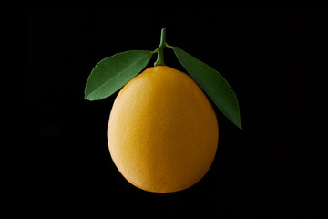 lemon fruit with leaf isolated on black background