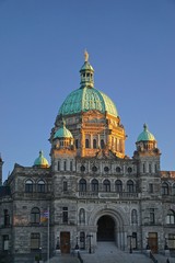 Fototapeta na wymiar Victoria, British Columbia, Canada: The Neo-Baroque architecture of the British Columbia Parliament Buildings (1897), at sunset.