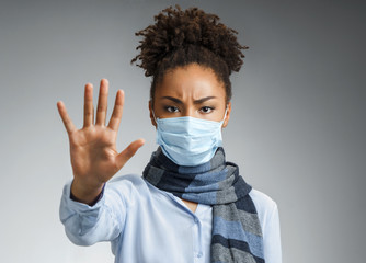 Stop the infection! Healthy woman showing gesture 