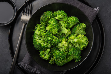 steamed broccoli in black bowl