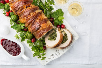 bacon wrapped turkey breast stuffed with spinach and cheese for festive dinner