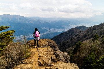 A woman admiring the spectacular view after a long hike