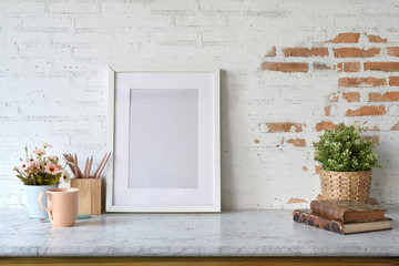 Mockup blank poster with house plant over white brick wall.