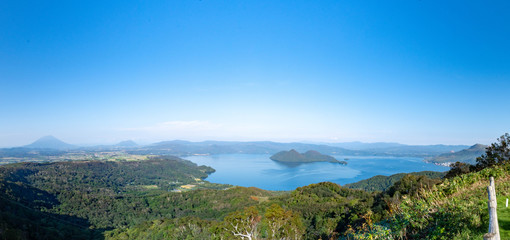 The whole view of Lake Toya. Panoramic image. Hokkaido, Japan