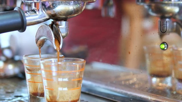 Closeup of tea maker machine during making shots in coffee shop