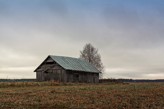 Old Barn House Against The Grey Skies