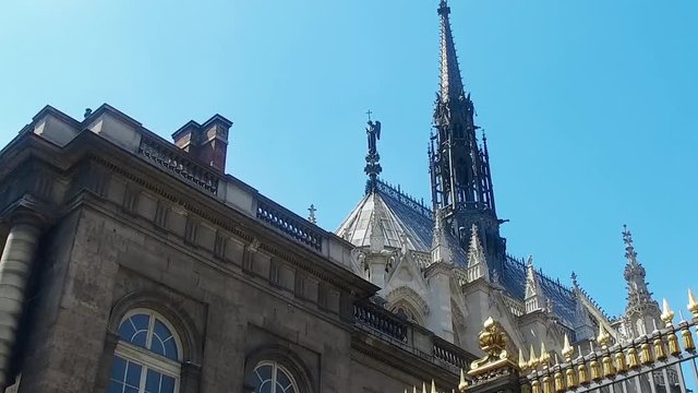The front entrance of the Palais de Justice and Sainte-Chapelle chapel in Paris, France in sunny summer day - architecture background