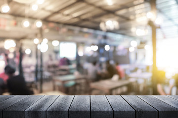 Close up top wood table for montage product display and design key visual layout at restaurant background. Space for placing items on the restaurant table.