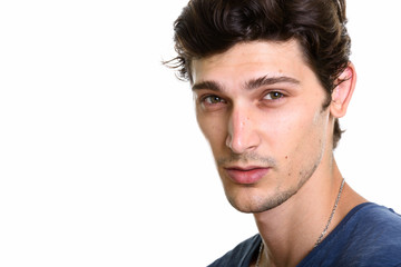 Fototapeta premium Face of young handsome Brazilian man looking at camera