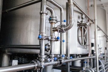 Production of milk and yogurt at the plant. Metal units and tanks for storage and transportation.