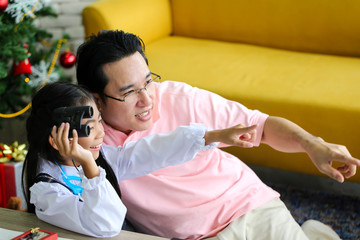 Parent and little child having fun playing educational toys,Family concept.