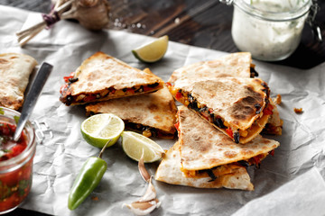 Vegetarian snacks quesadilla vegetables cheese dark wooden table