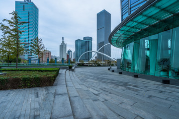 Panoramic skyline and buildings with empty square floor.