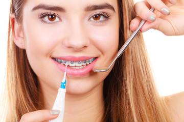 Woman with braces having dentist appointment
