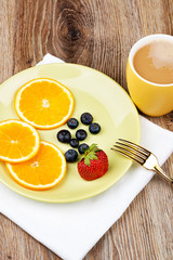 Photo of healthy breakfast on wooden background