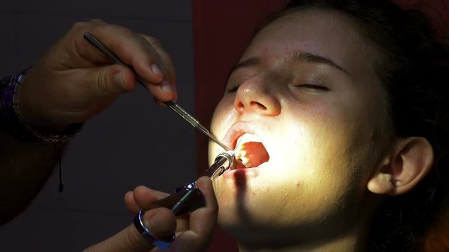 Dentist apply anesthetic injection before oral surgery operation