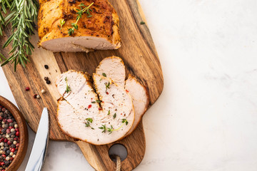 Christmas Turkey Breast Roll Stuffed with Cheese, Cranberries and Herbs, copy space.