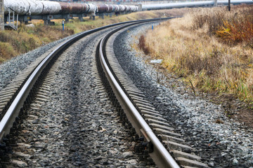 railway in the industrial zone..empty rails with a semaphore, in anticipation of a freight train.