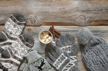 Warm woolen knitwear and cocoa with marshmallow