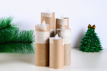 How to make white Christmas candles plugs toilet paper rolls, hot glue, paint and candles. Children's creativity. Christmas diy. Step by step on the photo, instructions.