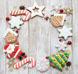 Christmas homemade gingerbread cookies on a wooden background