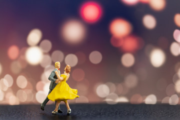 Miniature people , Couple dancing with bokeh background