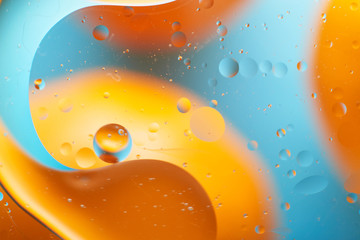 macro of oil drops on water background texture abstraction