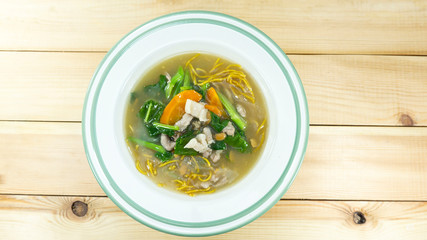 Noodles in Thick Gravy seafood in a dish on white background. Thai foods. Top view with copy space for your text..