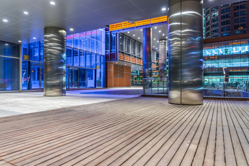 Empty wooden footpath front modern building in shanghai