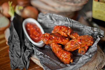 dish with fried ribs on a table