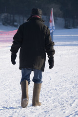 Two men walking down the street in an old revolutionary clothing, retro style Winter, Russia.