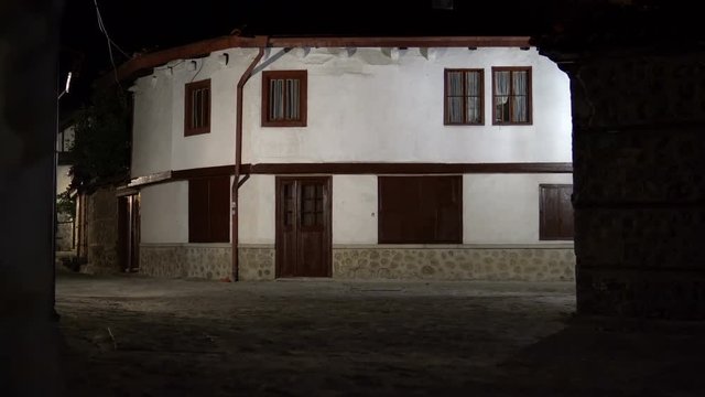 Establishment shot of Vintage dark alley and old traditional house in Bansko, Bulgaria. Bansko is most famous ski recreation centre in Bulgaria and Balcan peninsula