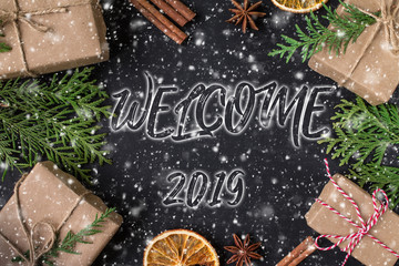     WELCOME 2019 hand lettering inscription on wooden background