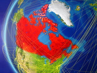 Canada from space on model of Earth with international network. Concept of digital communication or travel.