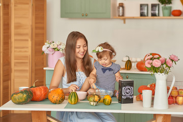 Family Thanksgiving Day. Family in kitchen.Tanksgiving celebration table with traditional festive food. Tanksgiving celebration dinner setting meal concept. Halloween Pumpkins.Autumn feast.Mothers Day