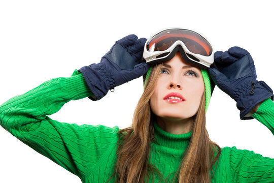 Active young ski woman portrait wearing winter clothing isolated over white