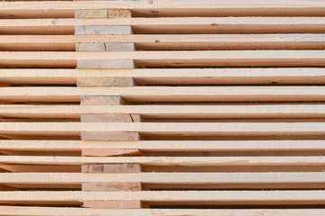 Stacked wooden pallets as background