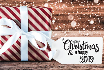 Fototapeta na wymiar Gift, Calligraphy Merry Christmas And A Happy 2019, Snowflakes