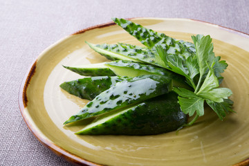 Salted and marinated cucumber served with parsley