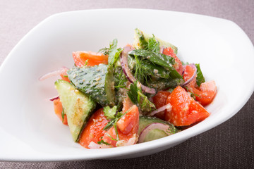 Fresh raw tomato and cucumber mixed salad