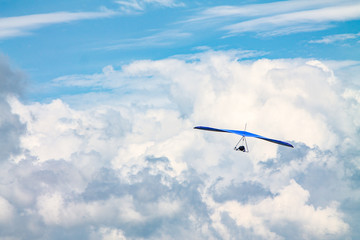 Light aircraft, deltaplane, against the sky with white clouds. deltaplane