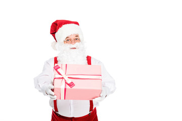 santa holding christmas present and looking at camera isolated on white